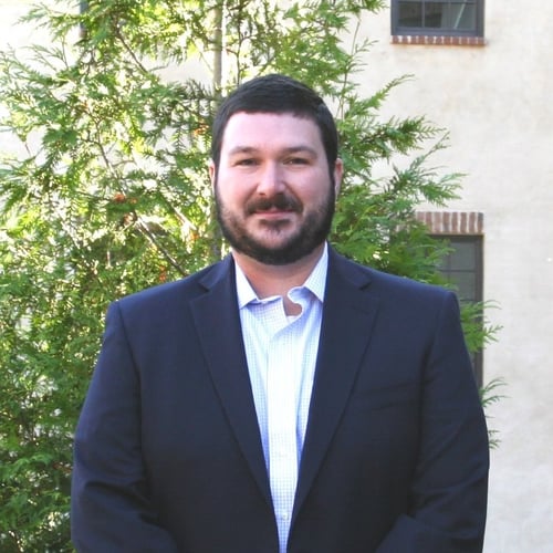 Headshot of TJ Claud, Chief Compliance Officer at OneAscent
